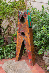 rusty clothing spring inside a building near trees