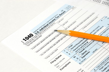 Obraz premium time to fill 1040 tax form, with pencil and form