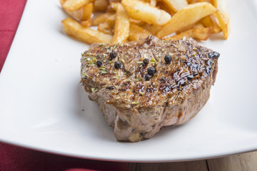 Rustic grilled beefsteak with french fries