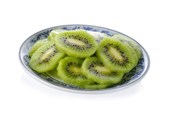 sliced kiwi fruit on plate with white background
