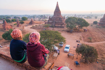 Tourists looking at sunset in Ancient Temples  at Bagan, Myanmar