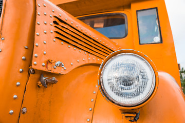 Front lamp of orange school bus