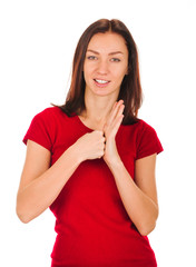 Exited young woman kicks clenched fist arm