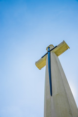 Christian cross with blue clear sky
