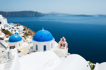 Church with blue domes in Oia town, Santorini island, Greece.