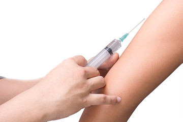 Doctor making injection in small hearth isolated on white backgr