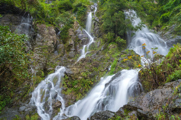 Fototapeta na wymiar Waterfall in deep rain forest jungle (Krok E Dok Waterfall Sarab