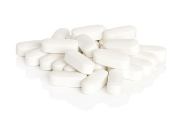 Fototapeta na wymiar Calcium Vitamin Supplements. A pile of calcium vitamin supplement tablets isolated on a white background.