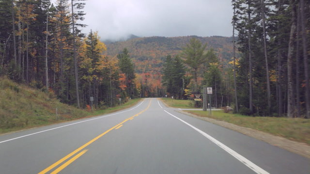 Time lapse driving POV on the Kancamagus (Kanc) Highway during Autumn in the White Mountains of New Hampshire.
