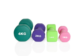 Fitness dumbbells. Green, pink and purple dumbbells isolated on white background. Weights for a...