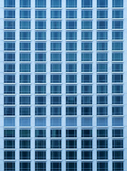 Close-up view of rich skyscraper condo with a lot of windows in Thailand. City texture.