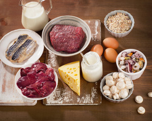 Foods Highest in Vitamin B12  on a wooden background. Healthy ea