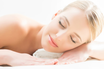 Fototapeta premium Beautiful girl sleeping and have a spa treatment isolated on white.