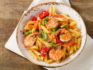 Penne pasta with shrimp, tomatoes and herbs