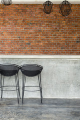 cement counter nightclub with seat bar stool and brick wall