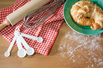 Croissant baked on wood background