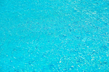 blue swimming pool with sunny reflections abstract for backgroun