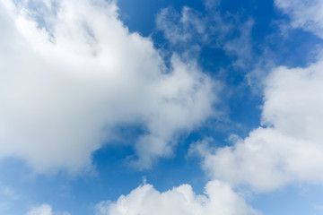 fluffy cloud above blue sky background