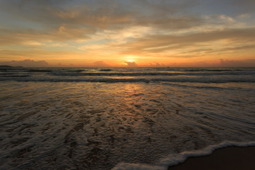 sunset dramatic sky with colorful cloud on the beach