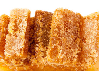 Slices of honeycomb isolated on white.