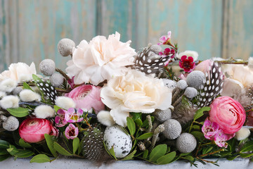 Floral arrangement with carnation and ranunculus flowers