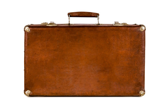 Old shabby brown suitcase with angle bars. Retro suitcase. Vintage baggage. Vintage travel bag.