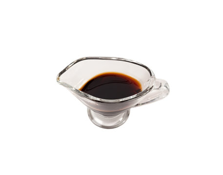 Soy sauce in glass saucers isolated on white background.