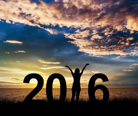 Silhouette young woman Enjoying on the hill and 2016 years