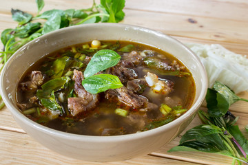 Beef  Spicy Soup on wooden table - Thai cuisine and Food