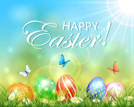 Easter sunny background with eggs in grass