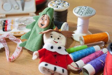 Handmade Christmas doll finger for Christmas gift on wood backgr