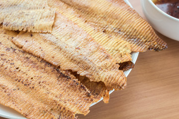 Crispy squid,snack on wooden table