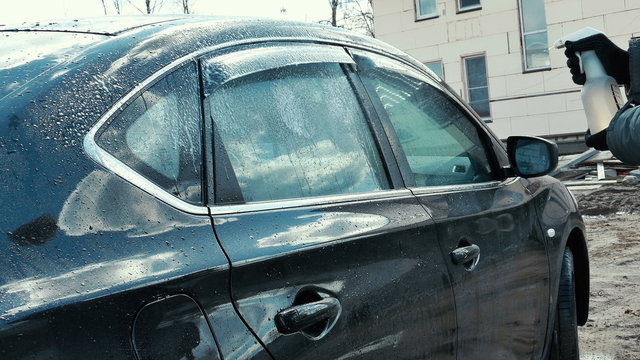 Washing The Car With High Pressure Washer