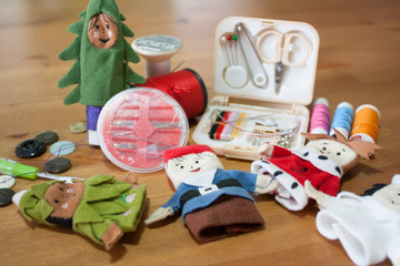 Handmade Christmas doll finger for Christmas gift on wood backgr