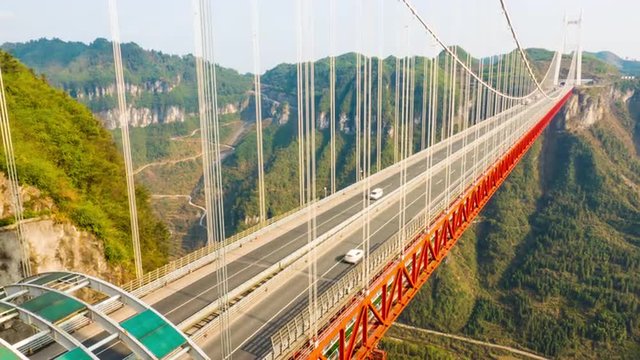 Aizhai Bridge 矮寨特大桥 Jishou,Hunan,China , 1102 ft/ 336 meters high,3858 ft/ 1176 meters span, Aizhai Bridge is the world&rsquo;s highest and longest tunnel to tunnel bridge.