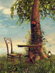 Stolik i krzesło na wiosennej łące pod drzewem