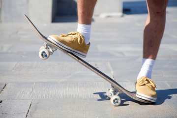 Fototapeta na wymiar Skateboarders Feet Close Up