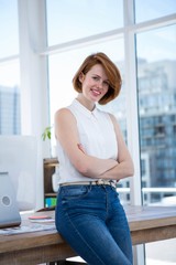 Fototapeta na wymiar smiling hipster business woman with her arms crossed