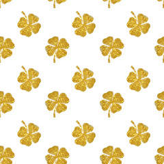 Seamless pattern of abstract four-leaf clovers of gold glitter