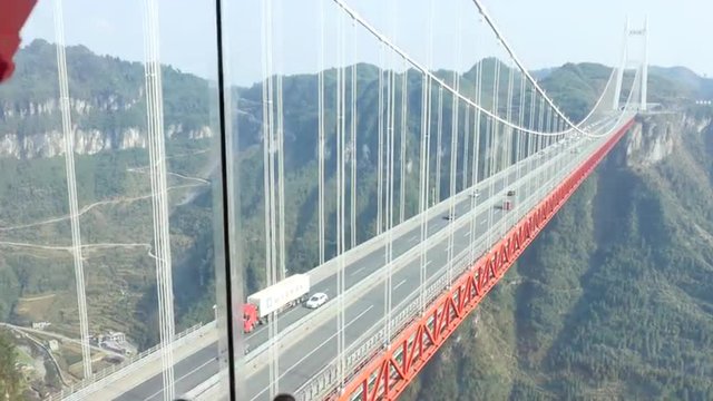Aizhai Bridge 矮寨特大桥 Jishou,Hunan,China , 1102 ft/ 336 meters high,3858 ft/ 1176 meters span, Aizhai Bridge is the world&rsquo;s highest and longest tunnel to tunnel bridge.