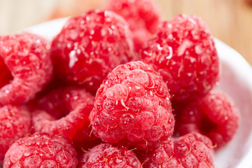 Macro of raspberries in china dish