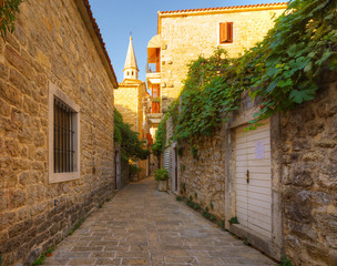 Fototapeta na wymiar view narrow street in old district of Budva, Montenegro