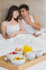 Obraz na płótnie Canvas Breakfast tray on bed