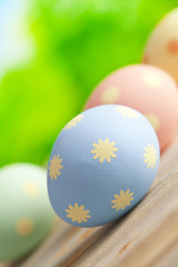 Easter eggs in pastel color on nature background