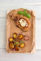 Steak and baked potatoes with garlic