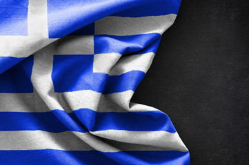 Fototapeta premium Flag of Greece on blackboard background