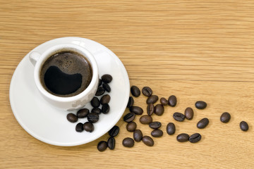 cup of coffee and grain kopi luwak
