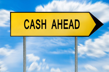 Yellow street concept cash ahead sign
