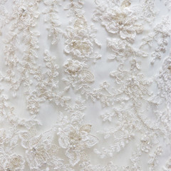 Background texture of white fabric with embroidery