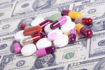 Pills and money. Health care concept
